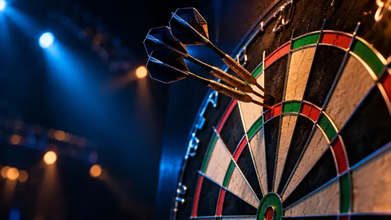 Tournament dartboard with three darts grouped in the treble twenty
