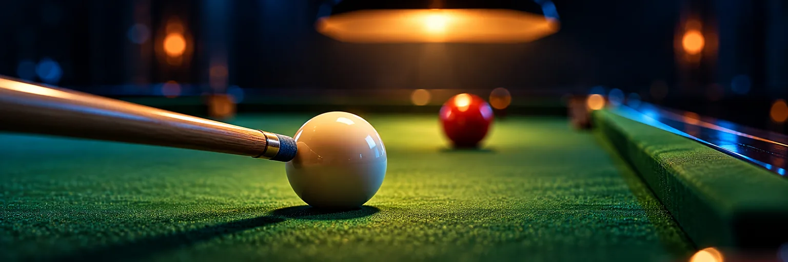 Close up of a chalked cue tip about to strike the white ball